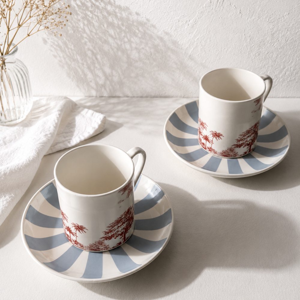 Portside Cup and Saucer, bone china cups on powder-blue striped saucers illustrated with the Prongs Lighthouse